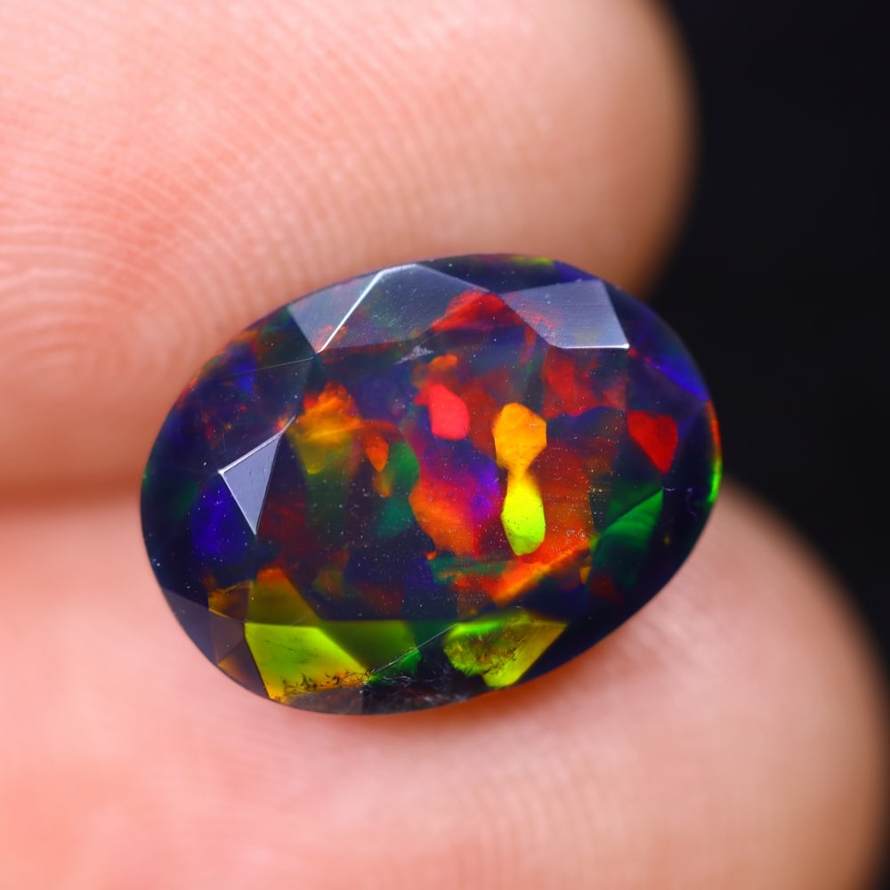 3.13Ct Welo Black Opal Faceted Polished - Ethiopian Opal , 388E: Ksmith Heritage Auctioneers Subject: Natural Ethiopian Welo Black Opal Origin: Ethiopia Carat Weight: 3.13Ct Dimension: 12.3x9.3x6.4 mm Treatment: Smoked Type: Faceted, Po