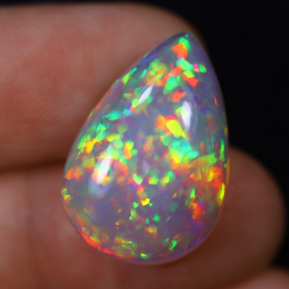 *11.22Ct Welo Opal Polished - Ethiopian Opal, 1145B: Ksmith Heritage Auctioneers Subject: Natural Ethiopian Welo Opal Origin: Ethiopia Carat Weight: 11.22Ct Dimension: 21.7x14.8x6.9 mm Treatment: Natural Untreated Type: Cabochon,