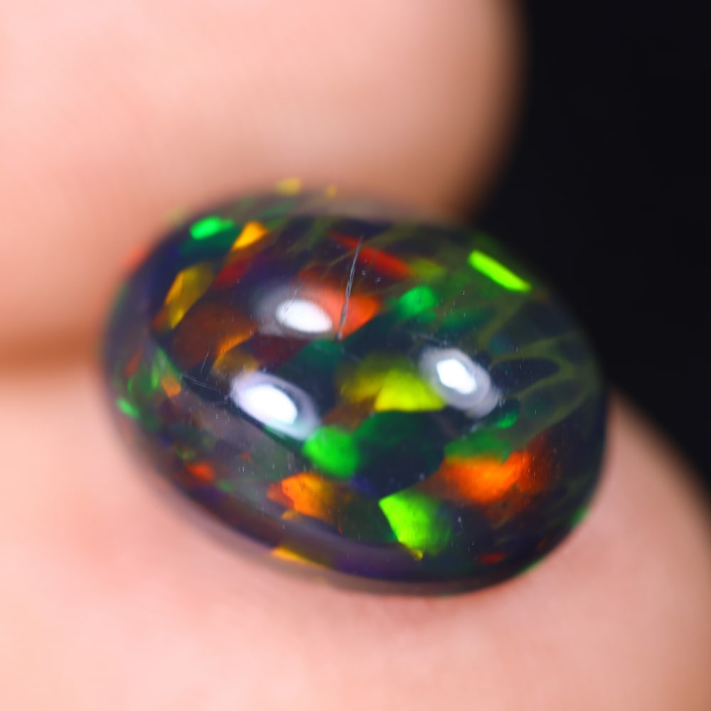 *2.89Ct Welo Black Opal Polished - Ethiopian Opal , 631E: Ksmith Heritage Auctioneers Subject: Natural Ethiopian Welo Black Opal Origin: Ethiopia Carat Weight: 2.89Ct Dimension: 11.9x9x5.5 mm Treatment: Smoked Type: Cabochon, Pol