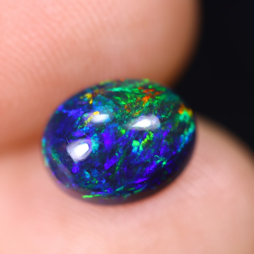 1.48Ct Welo Black Opal Polished - Ethiopian Opal , 664E: Ksmith Heritage Auctioneers Subject: Natural Ethiopian Welo Black Opal Origin: Ethiopia Carat Weight: 1.48Ct Dimension: 8.8x7x4.5 mm Treatment: Smoked Type: Cabochon, Poli