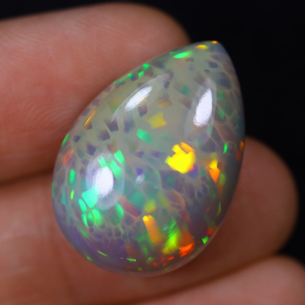 *14.96Ct Welo Opal Polished - Ethiopian Opal, 1179B: Ksmith Heritage Auctioneers Subject: Natural Ethiopian Welo Opal Origin: Ethiopia Carat Weight: 14.96Ct Dimension: 23.9x16.9x7.6 mm Treatment: Natural Untreated Type: Cabochon,