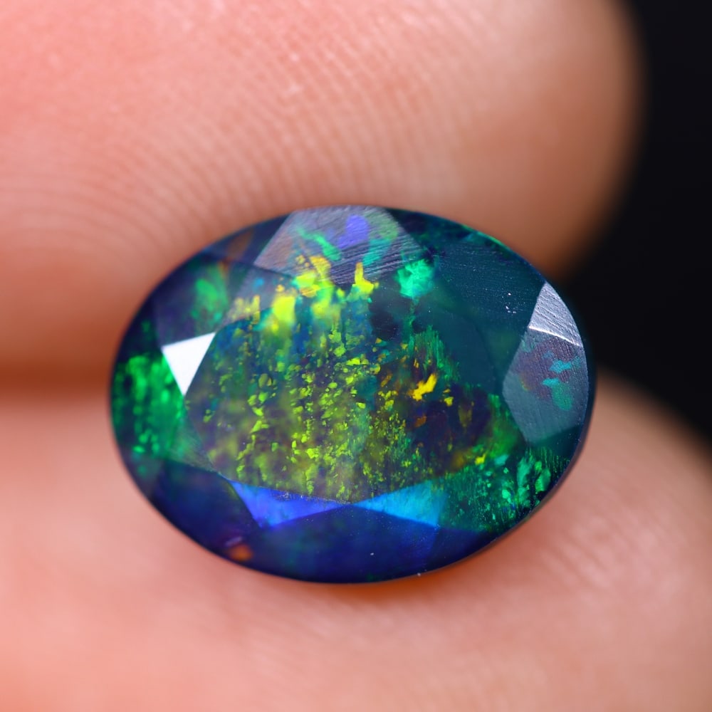 2.44Ct Welo Black Faceted Opal Polished - Ethiopian Opal , 440E: Ksmith Heritage Auctioneers Subject: Natural Ethiopian Welo Black Opal Origin: Ethiopia Carat Weight: 2.44Ct Dimension: 11.5x9x5.1 mm Treatment: Smoked Type: Faceted, Poli