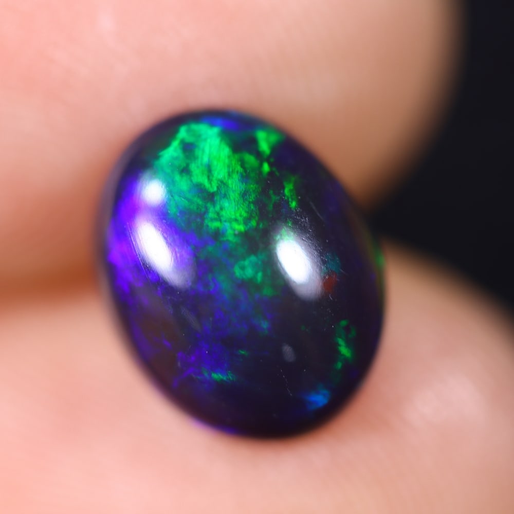 1.77Ct Welo Black Opal Polished - Ethiopian Opal , 651E: Ksmith Heritage Auctioneers Subject: Natural Ethiopian Welo Black Opal Origin: Ethiopia Carat Weight: 1.77Ct Dimension: 10x7.9x4.3 mm Treatment: Smoked Type: Cabochon, Pol
