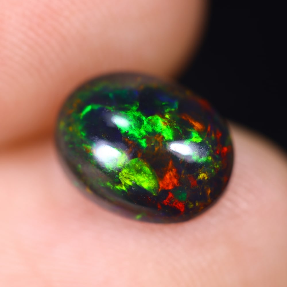 1.49Ct Welo Black Opal Polished - Ethiopian Opal , 399E: Ksmith Heritage Auctioneers Subject: Natural Ethiopian Welo Black Opal Origin: Ethiopia Carat Weight: 1.49Ct Dimension: 9.9x7.8x4 mm Treatment: Smoked Type: Cabochon, Poli