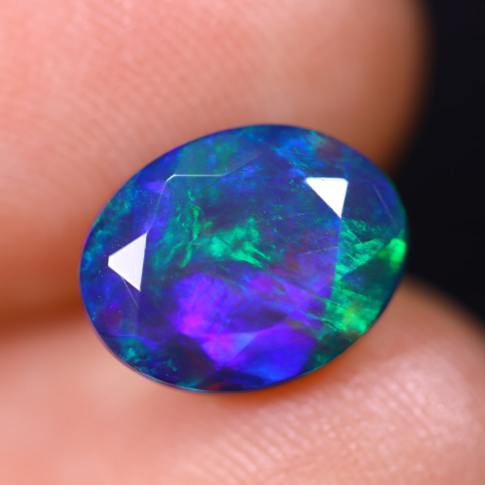 1.82Ct Welo Black Faceted Opal Polished - Ethiopian Opal , 496E: Ksmith Heritage Auctioneers Subject: Natural Ethiopian Welo Black Opal Origin: Ethiopia Carat Weight: 1.82Ct Dimension: 10.3x8x4.7 mm Treatment: Smoked Type: Faceted, Poli