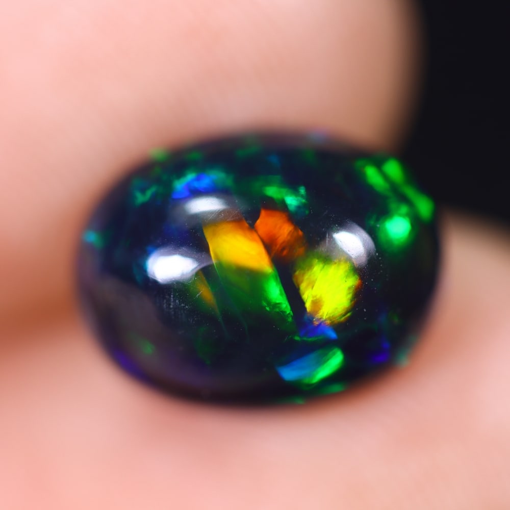 2.49Ct Welo Black Opal Polished - Ethiopian Opal , 560E: Ksmith Heritage Auctioneers Subject: Natural Ethiopian Welo Black Opal Origin: Ethiopia Carat Weight: 2.49Ct Dimension: 10.9x8.4x5.4 mm Treatment: Smoked Type: Cabochon, P