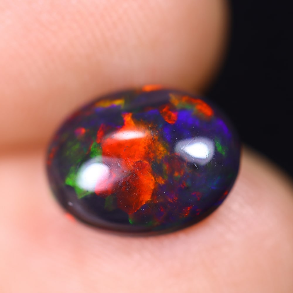 1.48Ct Welo Black Opal Polished - Ethiopian Opal , 634E: Ksmith Heritage Auctioneers Subject: Natural Ethiopian Welo Black Opal Origin: Ethiopia Carat Weight: 1.48Ct Dimension: 9.9x7.7x4 mm Treatment: Smoked Type: Cabochon, Poli