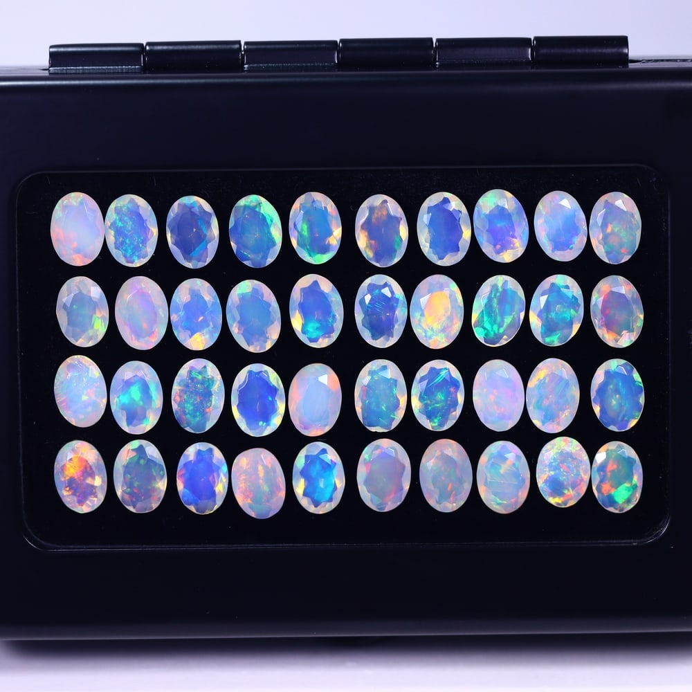 *19.23Ct Calibrated 7x5mm Faceted Welo Opal Set - Ethiopian Opal , 583E: Ksmith Heritage Auctioneers Subject: Natural Ethiopian Welo Opal Origin: Ethiopia Carat Weight: 19.23Ct Treatment: Natural Untreated Type: Faceted, Polished