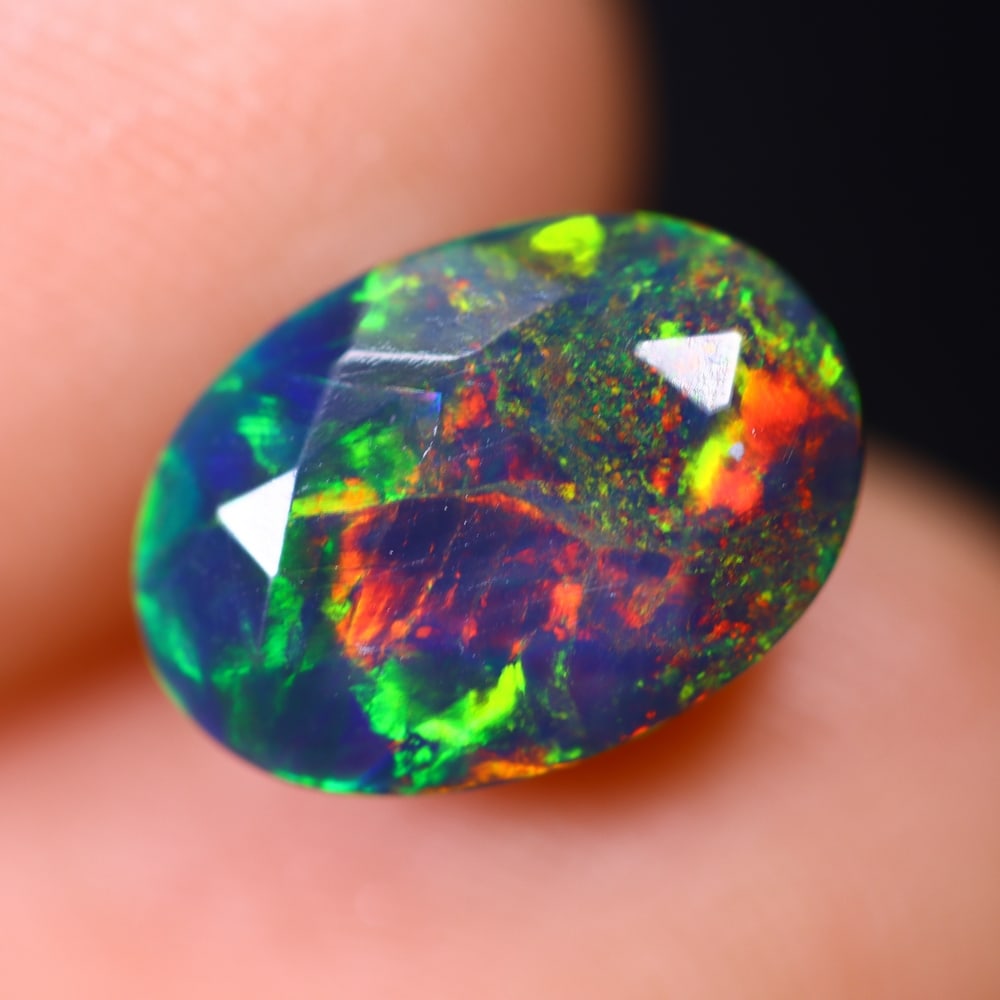 2.30Ct Welo Black Opal - Ethiopian Opal - Faceted Polished , 544E: Ksmith Heritage Auctioneers Subject: Natural Ethiopian Welo Black Opal Origin: Ethiopia Carat Weight: 2.30Ct Dimension: 11.6x8.2x6.1 mm Treatment: Smoked Type: Faceted, Po