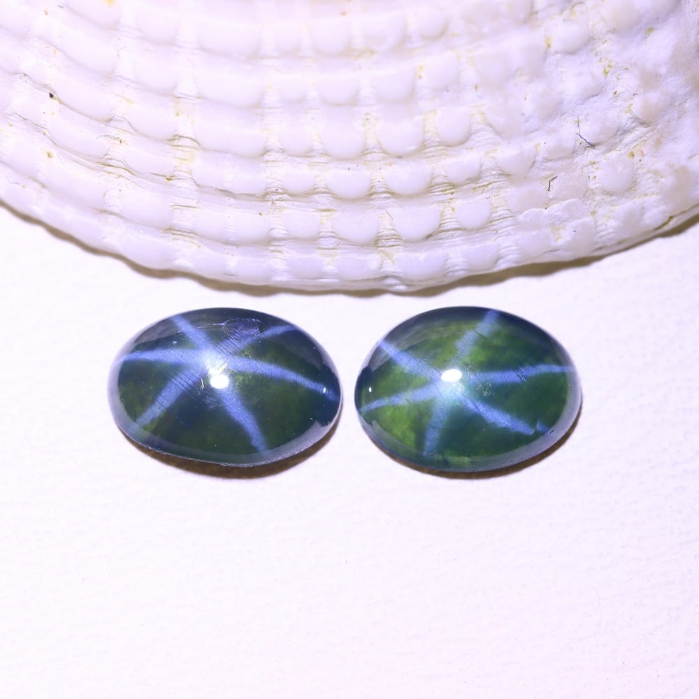 1.75cts 6 Rays Blue Star Sapphire Pair, 1211B: Ksmith Heritage Auctioneers Subject: Natural 6 Rays Star Sapphire Origin: Myanmar Carat Weight: 1.75cts Dimension: 6.7x5x2.2 mm Treatment: Diffusion Type: Cabochon, Polished