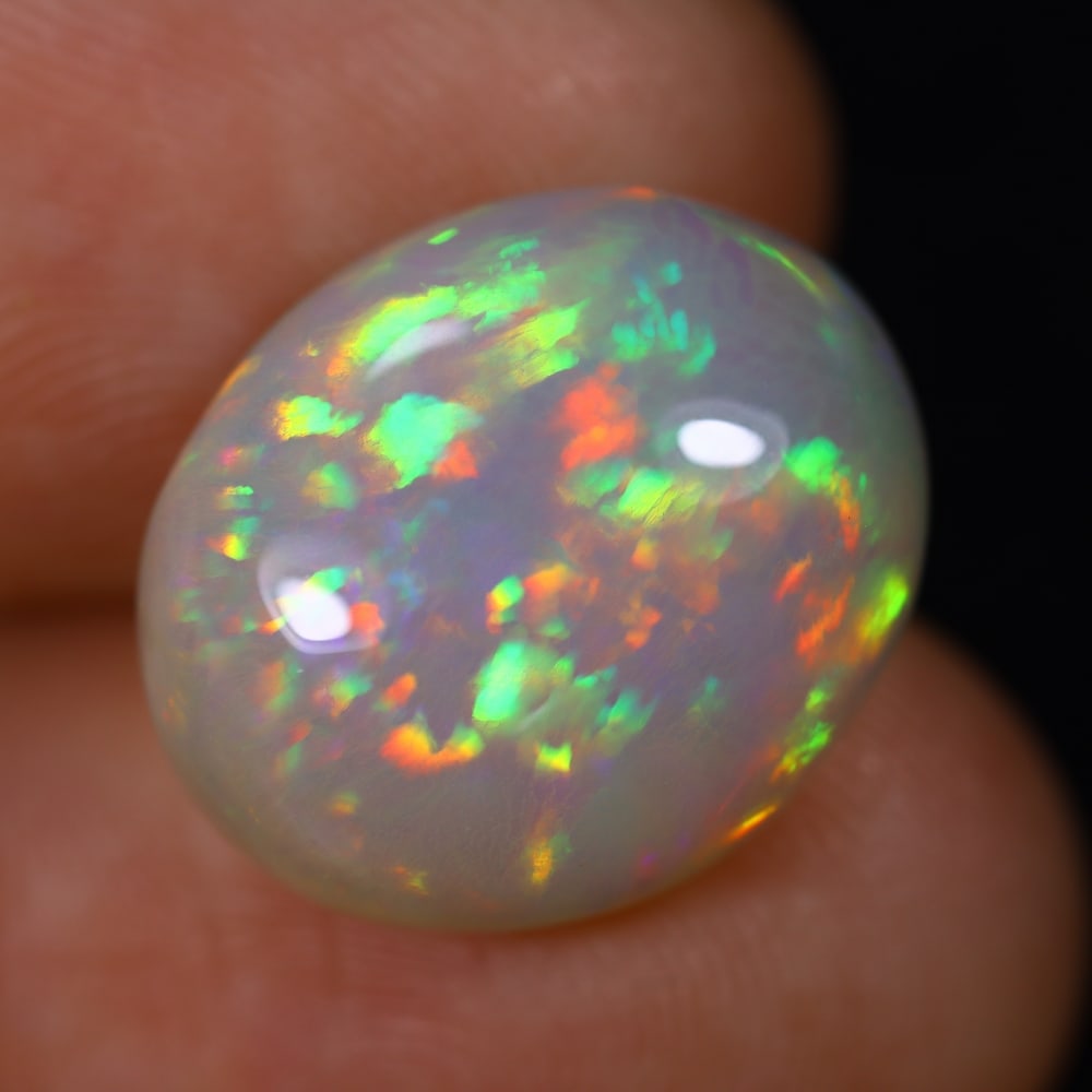 *7.08Ct Welo Opal Polished - Ethiopian Opal , 569E: Ksmith Heritage Auctioneers Subject: Natural Ethiopian Welo Opal Origin: Ethiopia Carat Weight: 7.08Ct Dimension: 16x13.3x6.7 mm Treatment: Natural Untreated Type: Cabocho