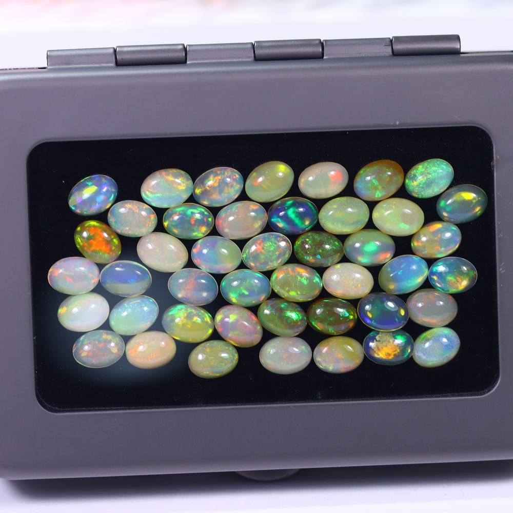 *22.22Ct Calibrated 7x5mm Welo Opal Set - Ethiopian Opal, 1127B: Ksmith Heritage Auctioneers Subject: Natural Ethiopian Welo Opal Origin: Ethiopia Carat Weight: 22.22Ct Dimension: 7x5.1x2.8 mm Treatment: Natural Untreated Type: Cabochon, Pol