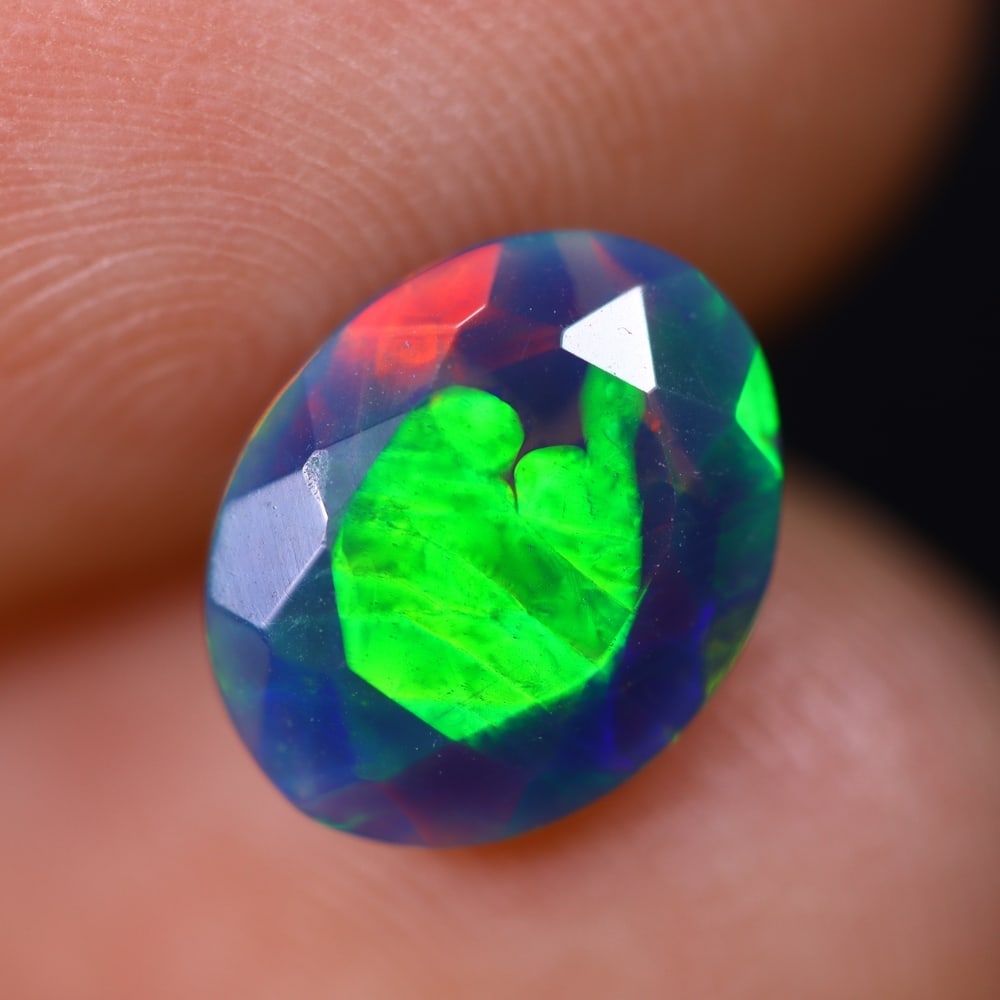 1.16Ct Welo Black Faceted Opal Polished - Ethiopian Opal , 459E: Ksmith Heritage Auctioneers Subject: Natural Ethiopian Welo Black Opal Origin: Ethiopia Carat Weight: 1.16Ct Dimension: 9.8x7.9x3.9 mm Treatment: Smoked Type: Faceted, Pol