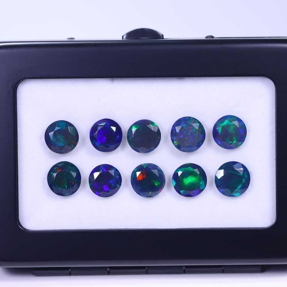 *12.78Ct 10pcs Faceted Smoked Welo Opal Set - Ethiopian Opal , 357E: Ksmith Heritage Auctioneers Subject: Natural Ethiopian Black Welo Opal Origin: Ethiopia Carat Weight: 12.78Ct Dimension: 8x8x4 mm Treatment: Heated Type: Faceted, Polished