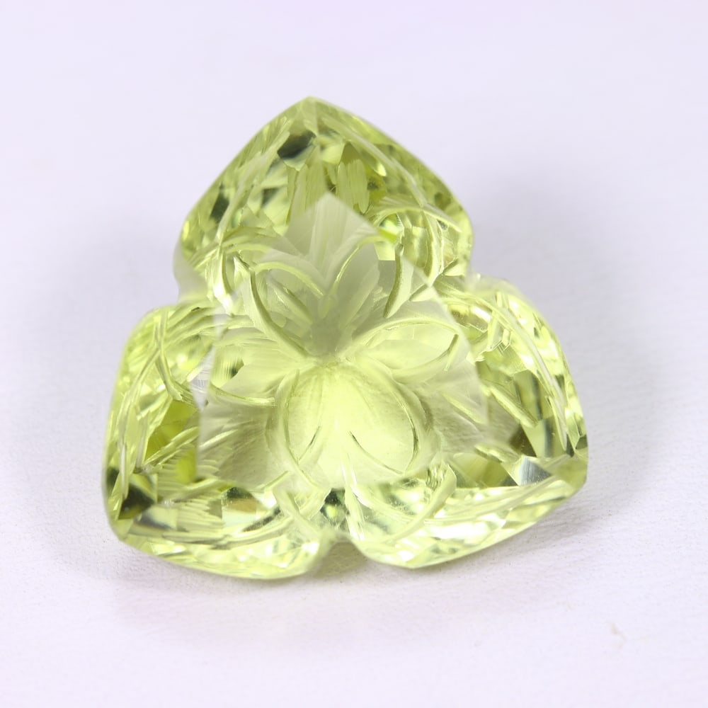 32.24Ct Lemon Carving Quartz - Polished Carving , 524E: Ksmith Heritage Auctioneers Subject: Natural Lemon Quartz Origin: Brazil Carat Weight: 21.24Ct Dimension: 22.5x21.9x12.8 mm Treatment: Untreated Type: Carving, Polished