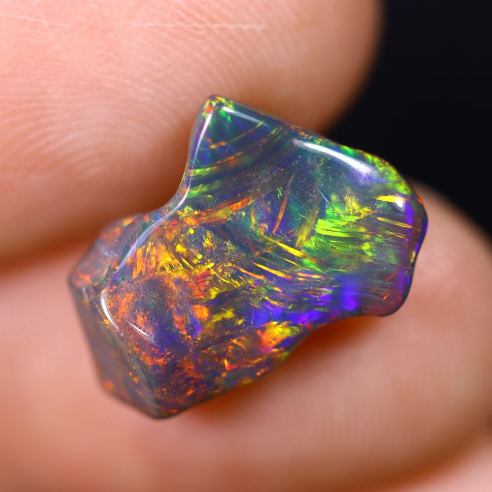 3.51Ct Natural Freeform Black Opal - 13x11x4mm - Polished Rough , 553E: Ksmith Heritage Auctioneers Subject: Natural Opal Origin: Ethiopia Treatment: Smoked Shape: Freeform Type: Polished Rough