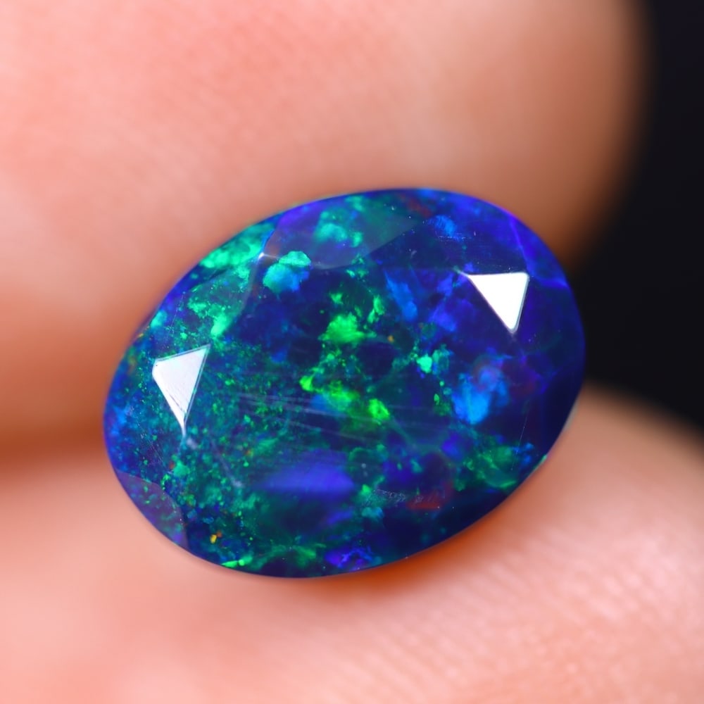 1.97Ct Welo Black Faceted Opal Polished - Ethiopian Opal , 445E: Ksmith Heritage Auctioneers Subject: Natural Ethiopian Welo Black Opal Origin: Ethiopia Carat Weight: 1.97Ct Dimension: 10.1x7.7x5.3 mm Treatment: Smoked Type: Faceted, Po