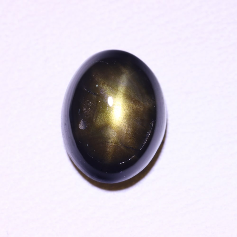 *2.55cts 6 Rays Black Star Sapphire , 315E: Ksmith Heritage Auctioneers Subject: Natural 6 Rays Star Sapphire Origin: Myanmar Carat Weight: 2.55 cts Dimension: 8.3x6.4x3.8 mm Treatment: Diffusion Type: Cabochon, Pol