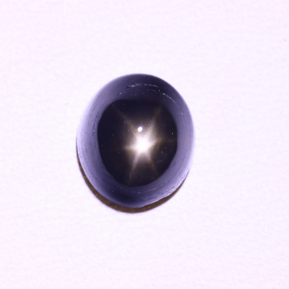 *1.77cts 6 Rays Black Star Sapphire , 317E: Ksmith Heritage Auctioneers Subject: Natural 6 Rays Star Sapphire Origin: Myanmar Carat Weight: 1.77 cts Dimension: 6.9x5.9x3.8 mm Treatment: Diffusion Type: Cabochon, Pol