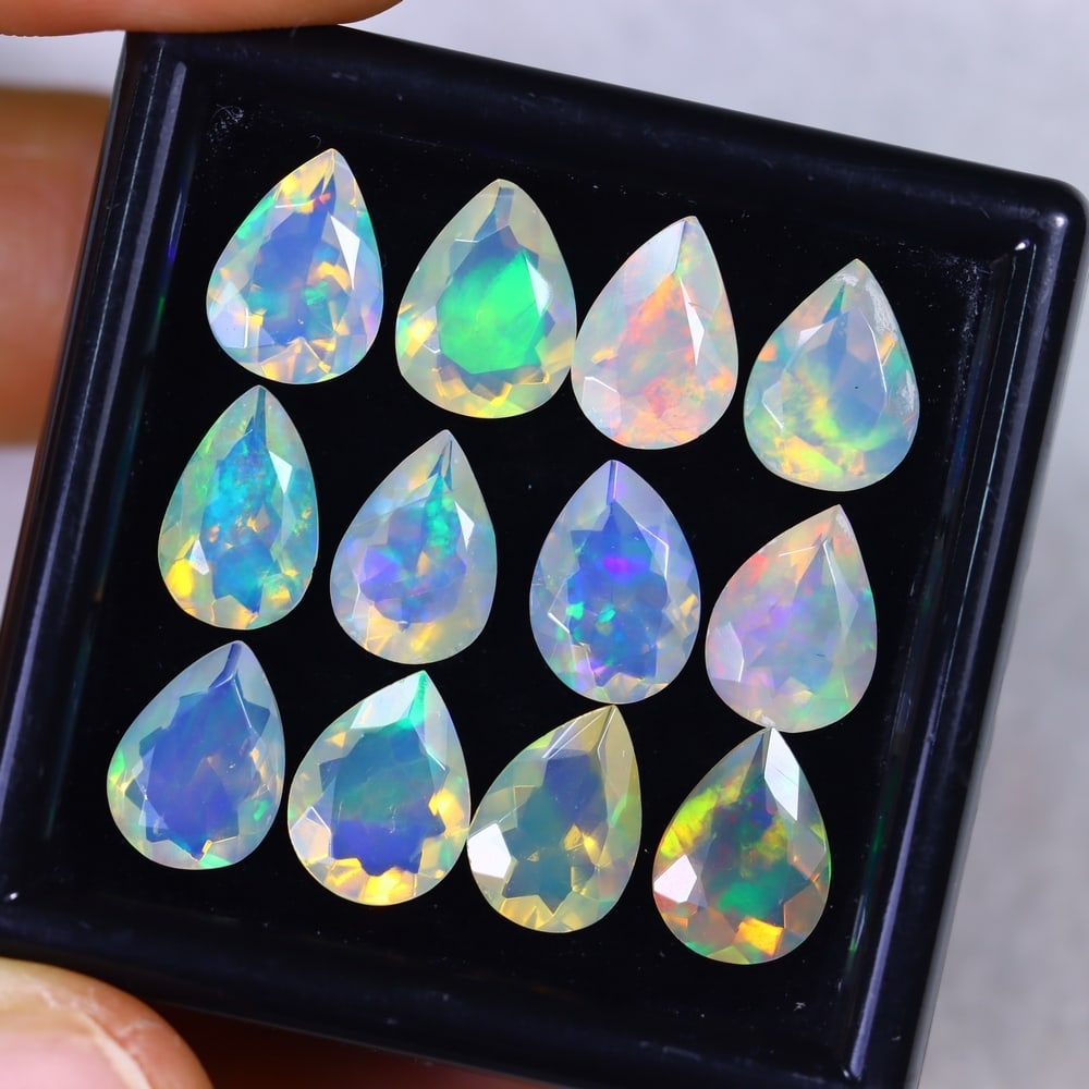 12.90Ct Welo Opal Lot - Ethiopian Opal - Pear Faceted, 1019B: Ksmith Heritage Auctioneers Subject: Natural Ethiopian Welo Opal Origin: Ethiopia Carat Weight: 12.90Ct Dimension: 9.7 x 7.2 x 4.1 mm Treatment: Natural Untreated Shape: Pear <