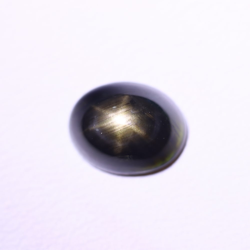 *3.34Ct 6 Rays Black Star Sapphire - Polished Cabochon , 546E: Ksmith Heritage Auctioneers Subject: Natural 6 Rays Star Sapphire Origin: Myanmar Carat Weight: 3.34Ct Dimension: 9.4x7.4x4.4 mm Treatment: Diffusion Type: Cabochon, Polis