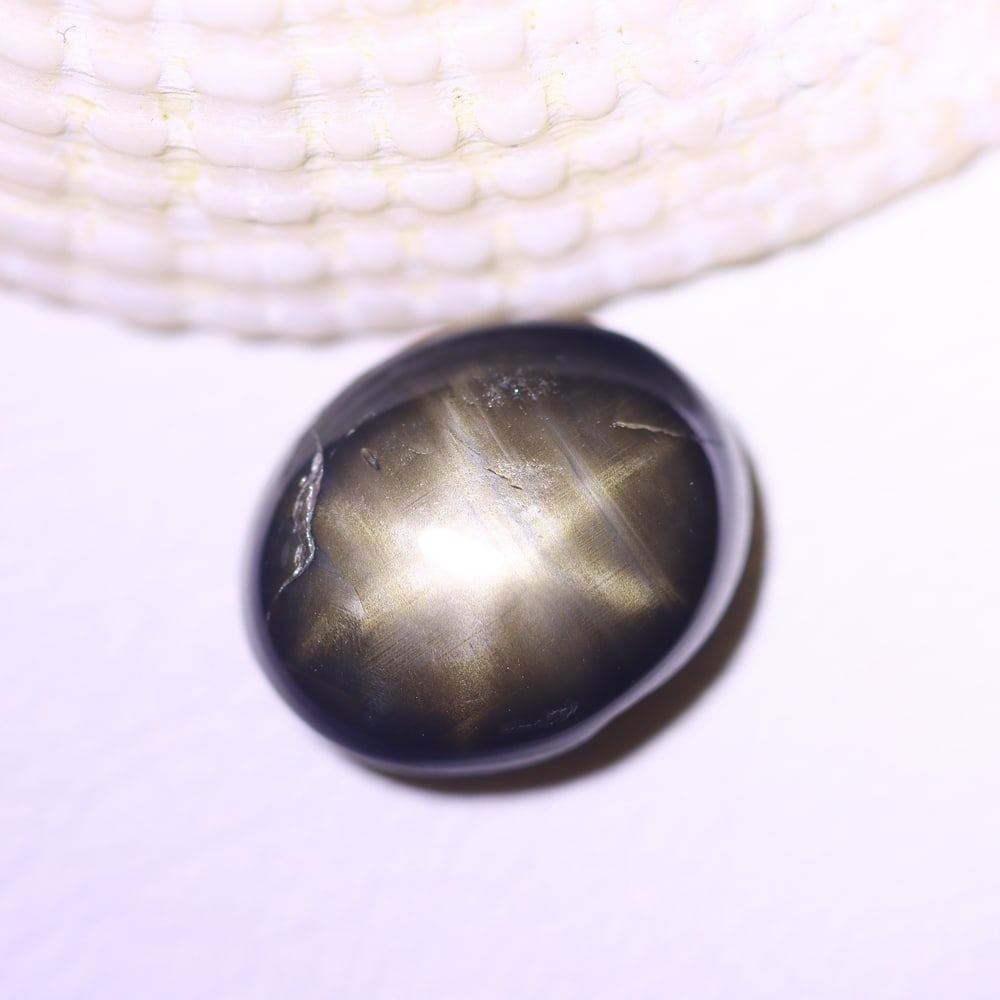 5.03cts 6 Rays Black Star Sapphire , 695E: Ksmith Heritage Auctioneers Subject: Natural 6 Rays Star Sapphire Origin: Myanmar Carat Weight: 5.03cts Dimension: 10.2x8.3x4.9 mm Treatment: Diffusion Type: Cabochon, Pol