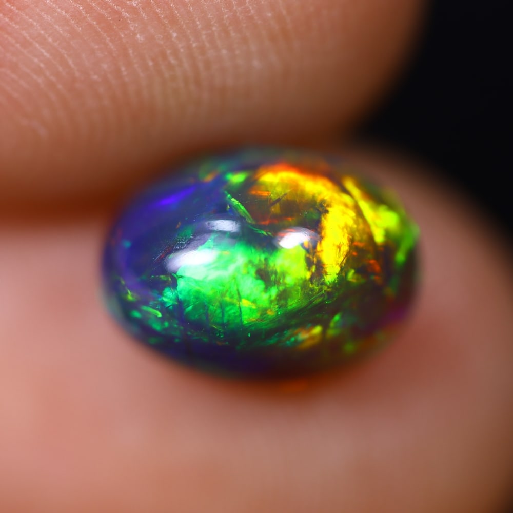 1.56Ct Welo Black Opal Polished - Ethiopian Opal , 567E: Ksmith Heritage Auctioneers Subject: Natural Ethiopian Welo Black Opal Origin: Ethiopia Carat Weight: 1.56Ct Dimension: 9.3x6.6x4.9 mm Treatment: Smoked Type: Cabochon, Po