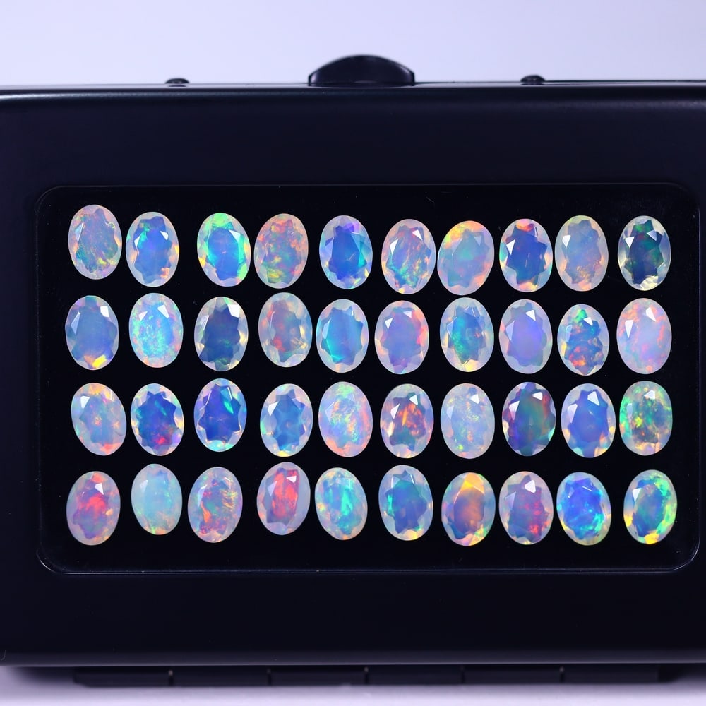 *20.10Ct Calibrated 7x5mm Faceted Welo Opal Set - Ethiopian Opal, 105B: Ksmith Heritage Auctioneers Subject: Natural Ethiopian Welo Opal Origin: Ethiopia Carat Weight: 20.10Ct Treatment: Natural Untreated Type: Faceted, Polished