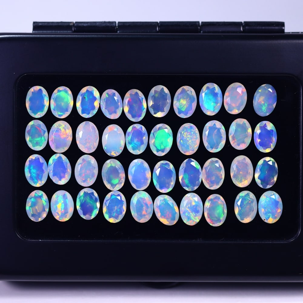 *19.22Ct Calibrated 7x5mm Faceted Welo Opal Set - Ethiopian Opal, 121B: Ksmith Heritage Auctioneers Subject: Natural Ethiopian Welo Opal Origin: Ethiopia Carat Weight: 19.22Ct Treatment: Natural Untreated Type: Faceted, Polished