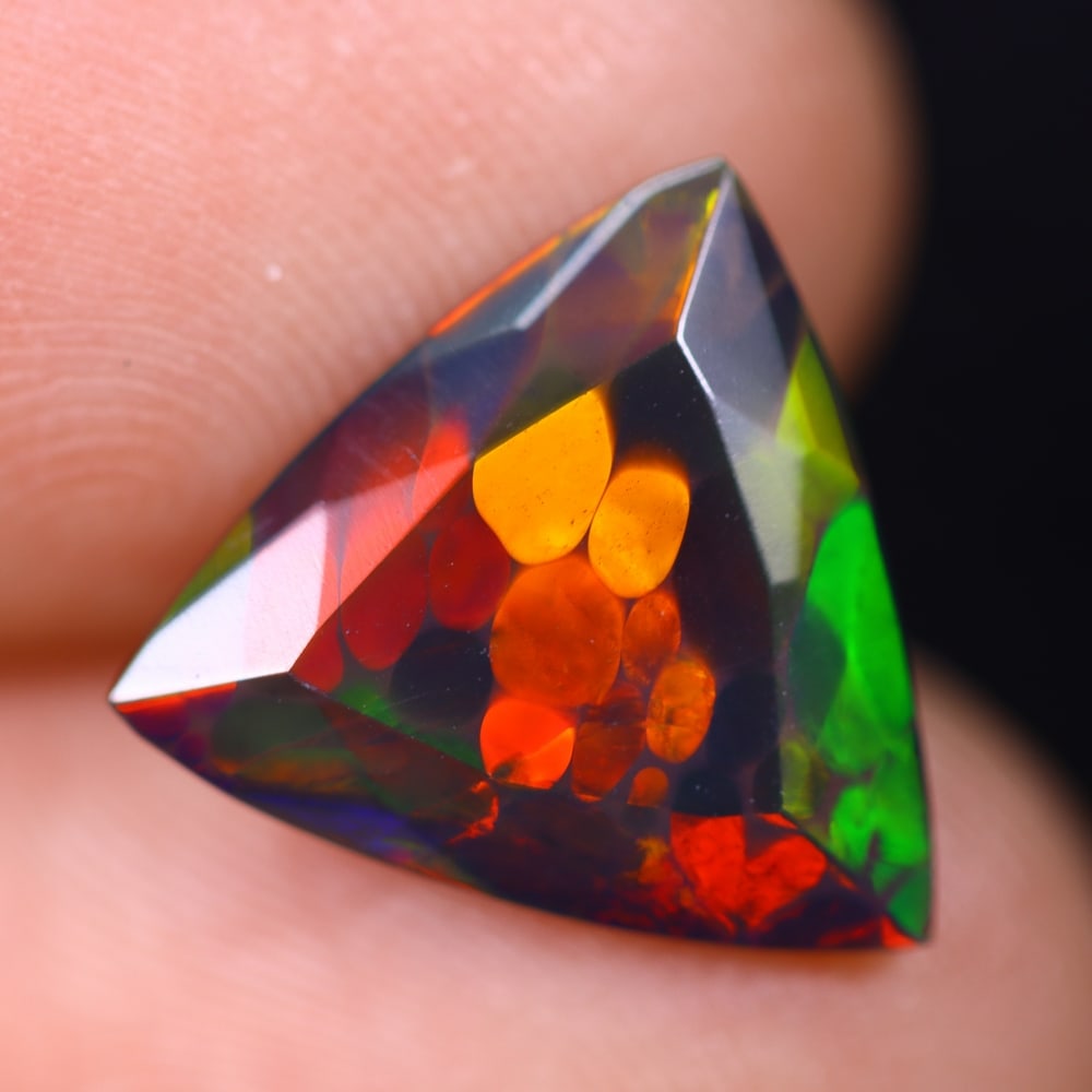 2.22Ct Welo Black Faceted Opal Polished - Ethiopian Opal , 334E: Ksmith Heritage Auctioneers Subject: Natural Ethiopian Welo Black Opal Origin: Ethiopia Carat Weight: 2.22Ct Dimension: 13x12.6x4.1 mm Treatment: Smoked Type: Faceted, Pol