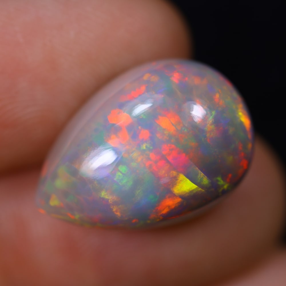 *8.77Ct Welo Opal Polished - Ethiopian Opal, 295B: Ksmith Heritage Auctioneers Subject: Natural Ethiopian Welo Opal Origin: Ethiopia Carat Weight: 8.77Ct Dimension: 18.1x12.6x8.3 mm Treatment: Natural Untreated Type: Cabochon,