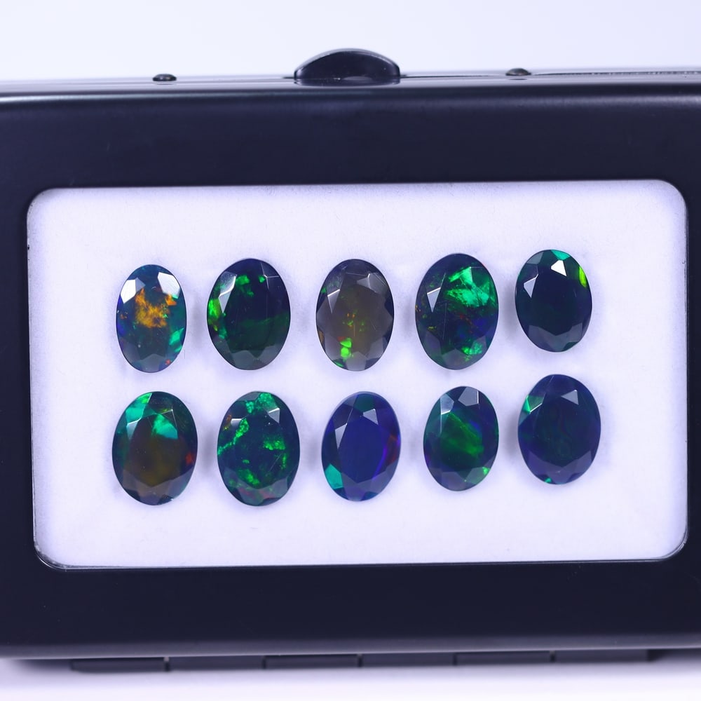 *14.21Ct 10pcs Faceted Smoked Welo Opal Set - Ethiopian Opal , 224E: Ksmith Heritage Auctioneers Subject: Natural Ethiopian Black Welo Opal Origin: Ethiopia Carat Weight: 14.21Ct Dimension: 10x7x3 mm Treatment: Heated Type: Faceted, Polishe