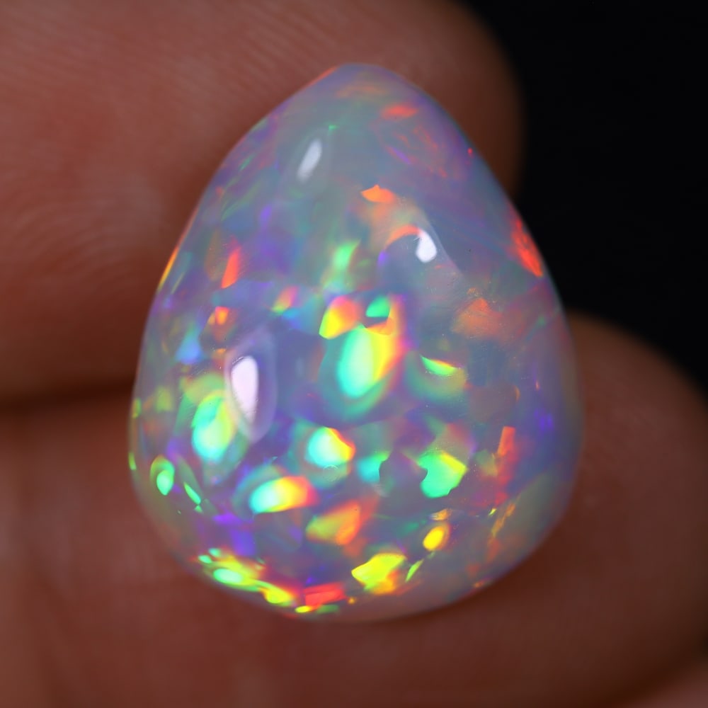*8.73Ct Welo Opal Polished - Ethiopian Opal , 106E: Ksmith Heritage Auctioneers Subject: Natural Ethiopian Welo Opal Origin: Ethiopia Carat Weight: 8.73Ct Dimension: 18x14.7x6.6 mm Treatment: Natural Untreated Type: Cabocho