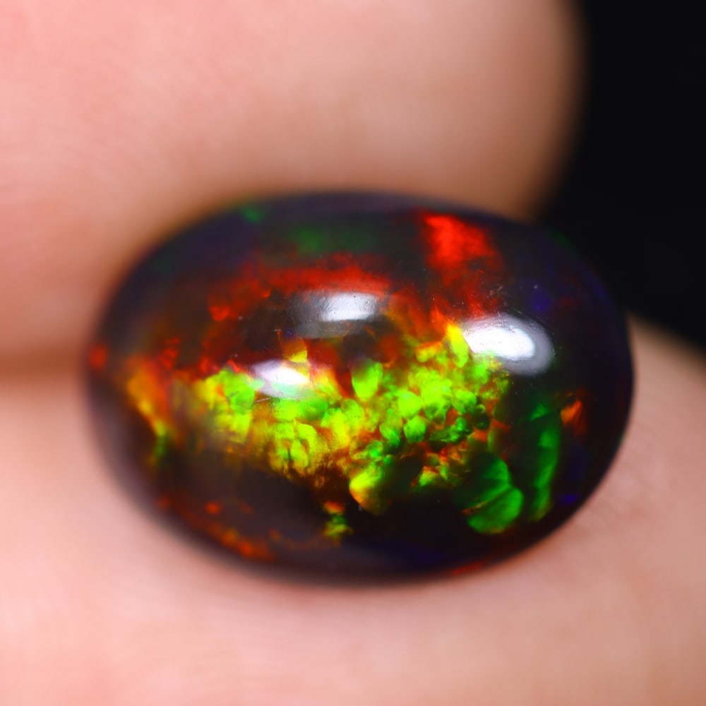 *2.97Ct Welo Black Opal Polished - Ethiopian Opal , 451E: Ksmith Heritage Auctioneers Subject: Natural Ethiopian Welo Black Opal Origin: Ethiopia Carat Weight: 2.97Ct Dimension: 13.7x9.8x4.9 mm Treatment: Smoked Type: Cabochon, P