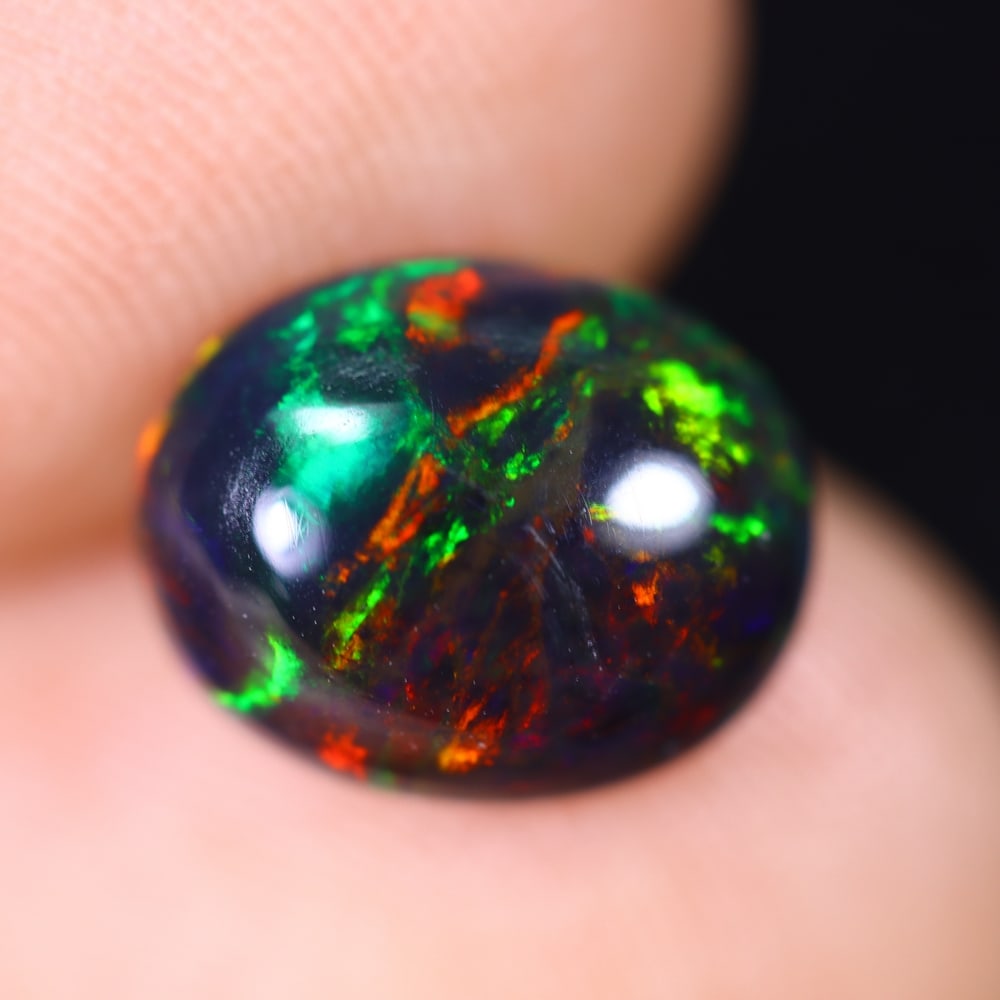 1.64Ct Welo Black Opal Polished - Ethiopian Opal , 238E: Ksmith Heritage Auctioneers Subject: Natural Ethiopian Welo Black Opal Origin: Ethiopia Carat Weight: 1.64Ct Dimension: 10.1x8.1x4.4 mm Treatment: Smoked Type: Cabochon, P