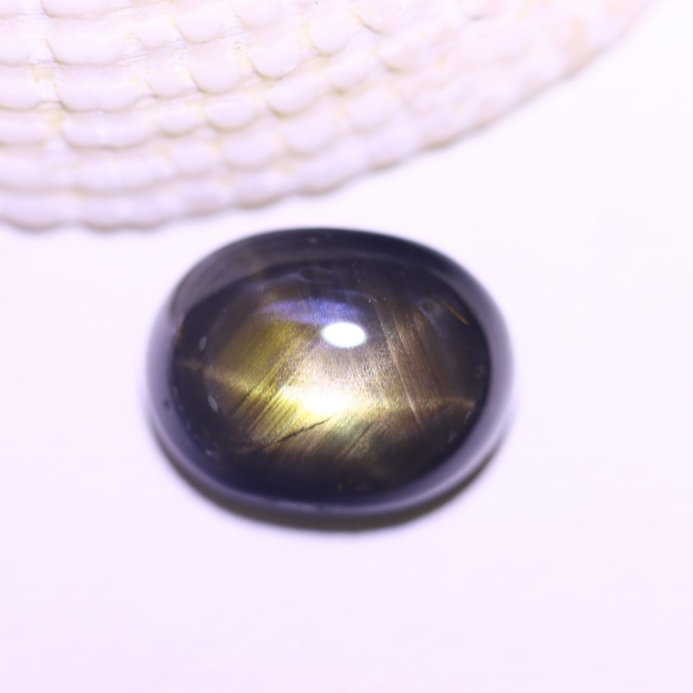 5.51cts 6 Rays Black Star Sapphire , 30E: Ksmith Heritage Auctioneers Subject: Natural 6 Rays Star Sapphire Origin: Myanmar Carat Weight: 5.51cts Dimension: 10.4x8x5.1 mm Treatment: Diffusion Type: Cabochon, Polis