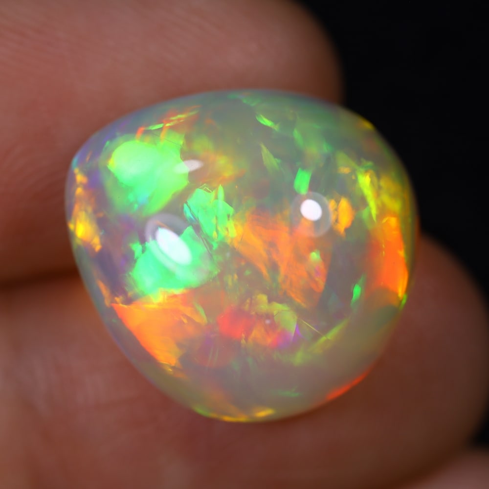 *12.35Ct Welo Opal Polished - Ethiopian Opal , 730E: Ksmith Heritage Auctioneers Subject: Natural Ethiopian Welo Opal Origin: Ethiopia Carat Weight: 12.35Ct Dimension: 17.3x16.1x8.7 mm Treatment: Natural Untreated Type: Cabo