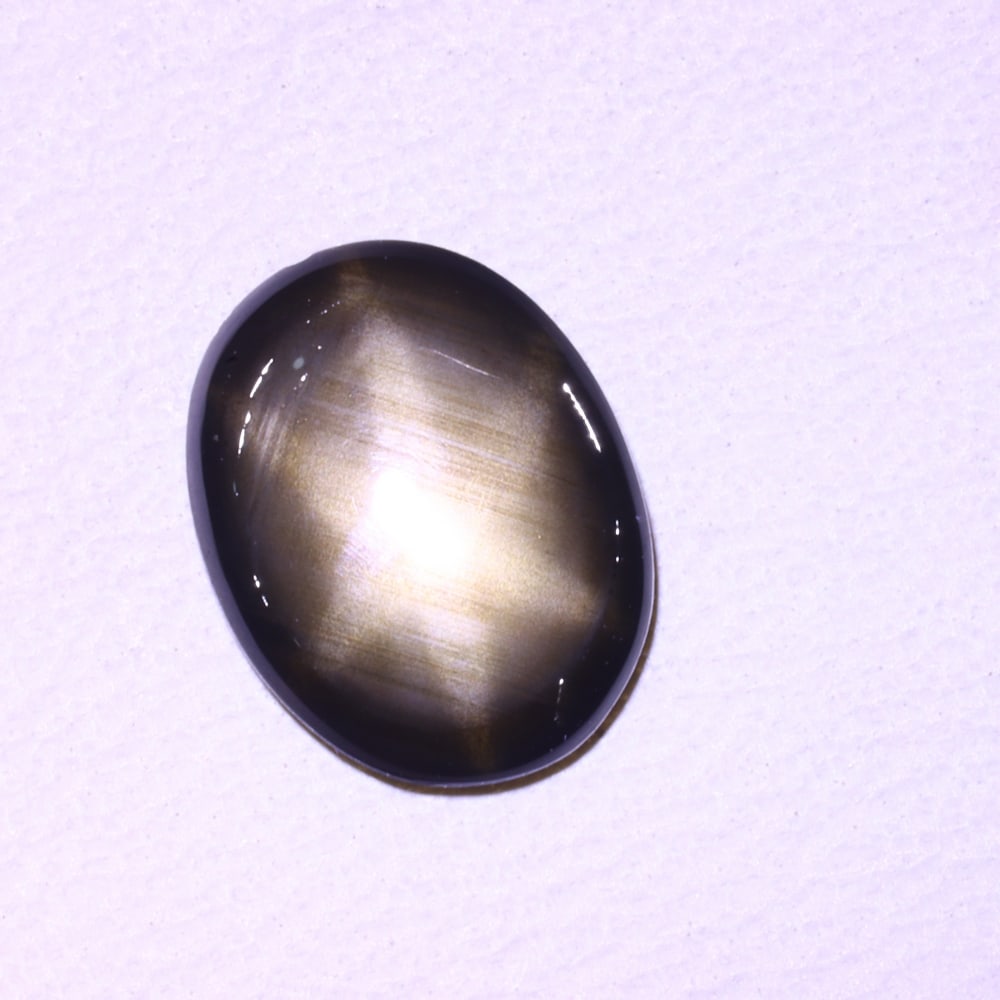 1.33cts 6 Rays Black Star Sapphire , 218E: Ksmith Heritage Auctioneers Subject: Natural 6 Rays Star Sapphire Origin: Myanmar Carat Weight: 1.33 cts Dimension: 8.4x6.4x1.7 mm Treatment: Diffusion Type: Cabochon, Pol