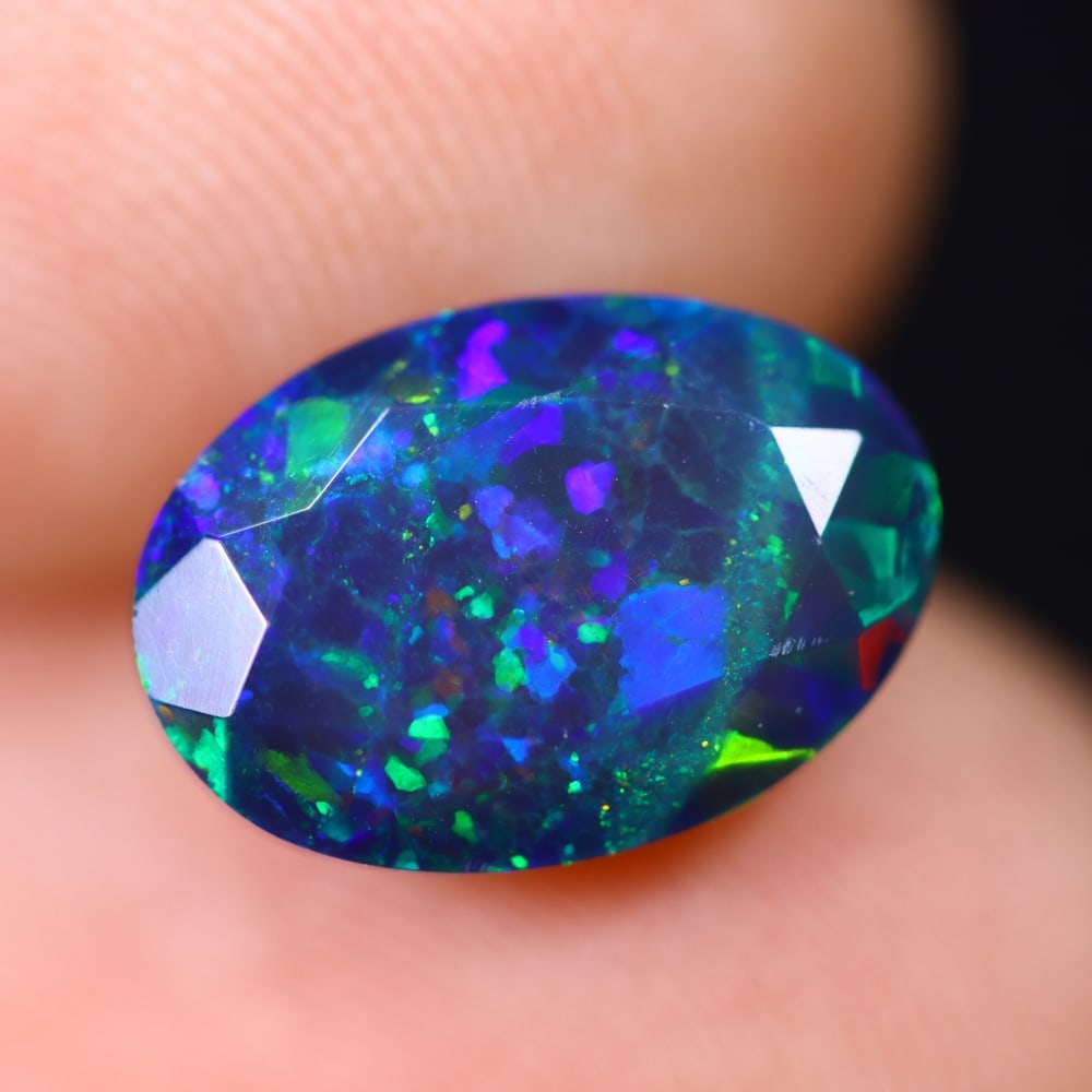 1.98Ct Welo Black Opal Faceted Polished - Ethiopian Opal , 878E: Ksmith Heritage Auctioneers Subject: Natural Ethiopian Welo Black Opal Origin: Ethiopia Carat Weight: 1.98Ct Dimension: 11x7.7x5.1 mm Treatment: Smoked Type: Faceted, Poli