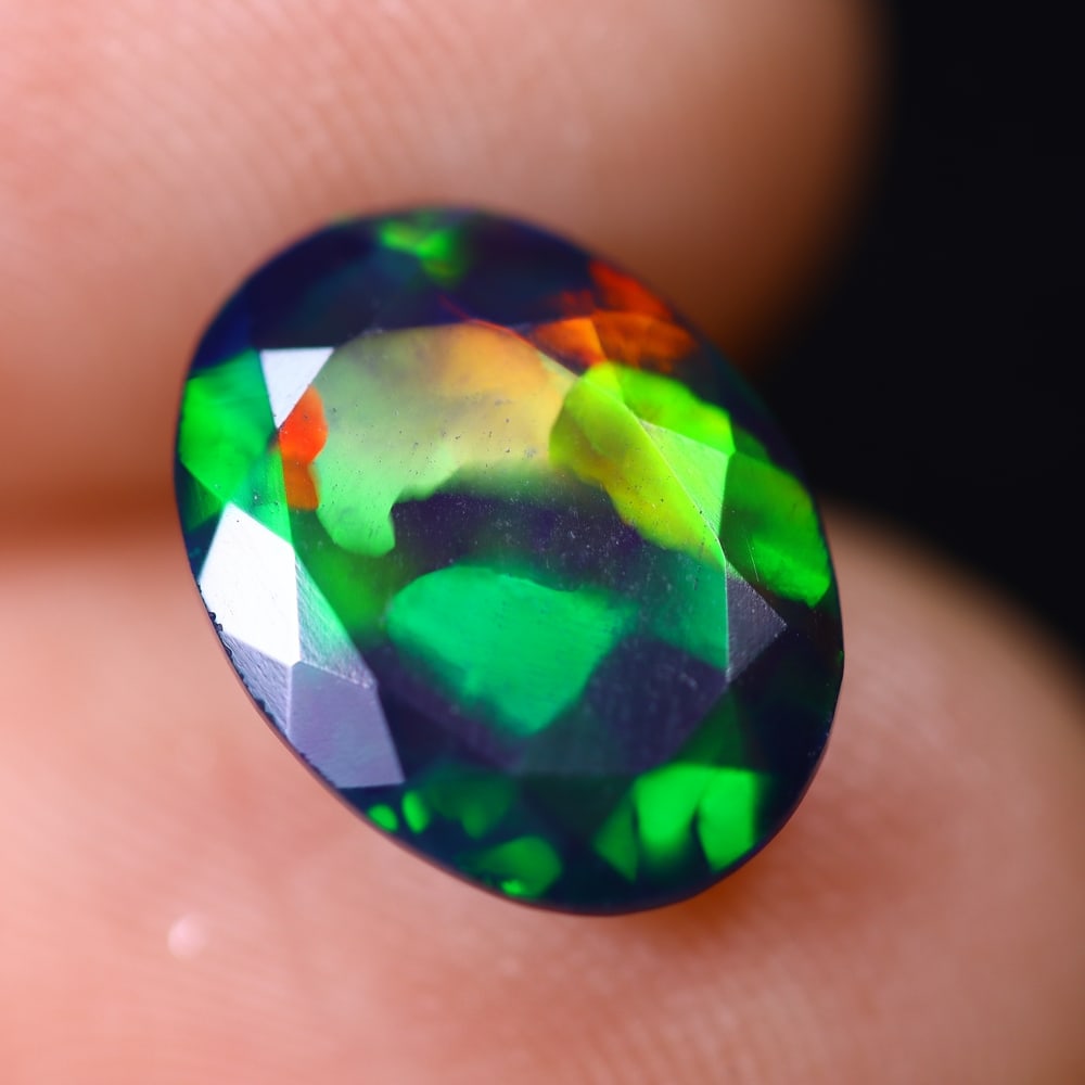 1.65Ct Welo Black Opal Faceted Polished - Ethiopian Opal , 793E: Ksmith Heritage Auctioneers Subject: Natural Ethiopian Welo Black Opal Origin: Ethiopia Carat Weight: 1.65Ct Dimension: 11.3x8.6x4 mm Treatment: Smoked Type: Faceted, Poli
