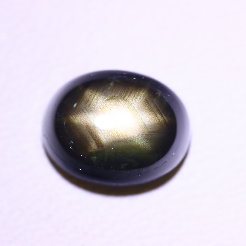 3.55cts 6 Rays Black Star Sapphire , 365E: Ksmith Heritage Auctioneers Subject: Natural 6 Rays Star Sapphire Origin: Myanmar Carat Weight: 3.55 cts Dimension: 8.8x6.8x4.3 mm Treatment: Diffusion Type: Cabochon, Pol