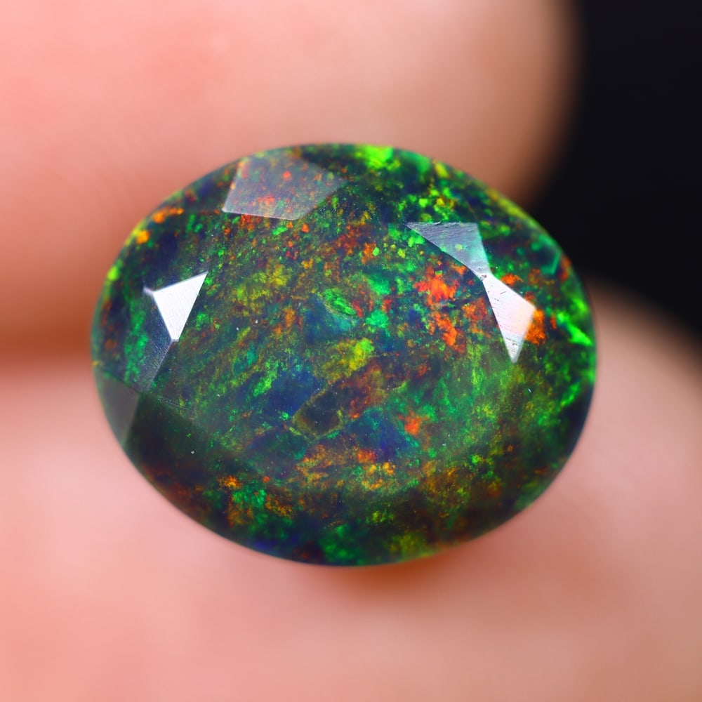3.83Ct Welo Black Faceted Opal Polished - Ethiopian Opal , 577E: Ksmith Heritage Auctioneers Subject: Natural Ethiopian Welo Black Opal Origin: Ethiopia Carat Weight: 3.83Ct Dimension: 11.8x9.8x7.6 mm Treatment: Smoked Type: Faceted, Po