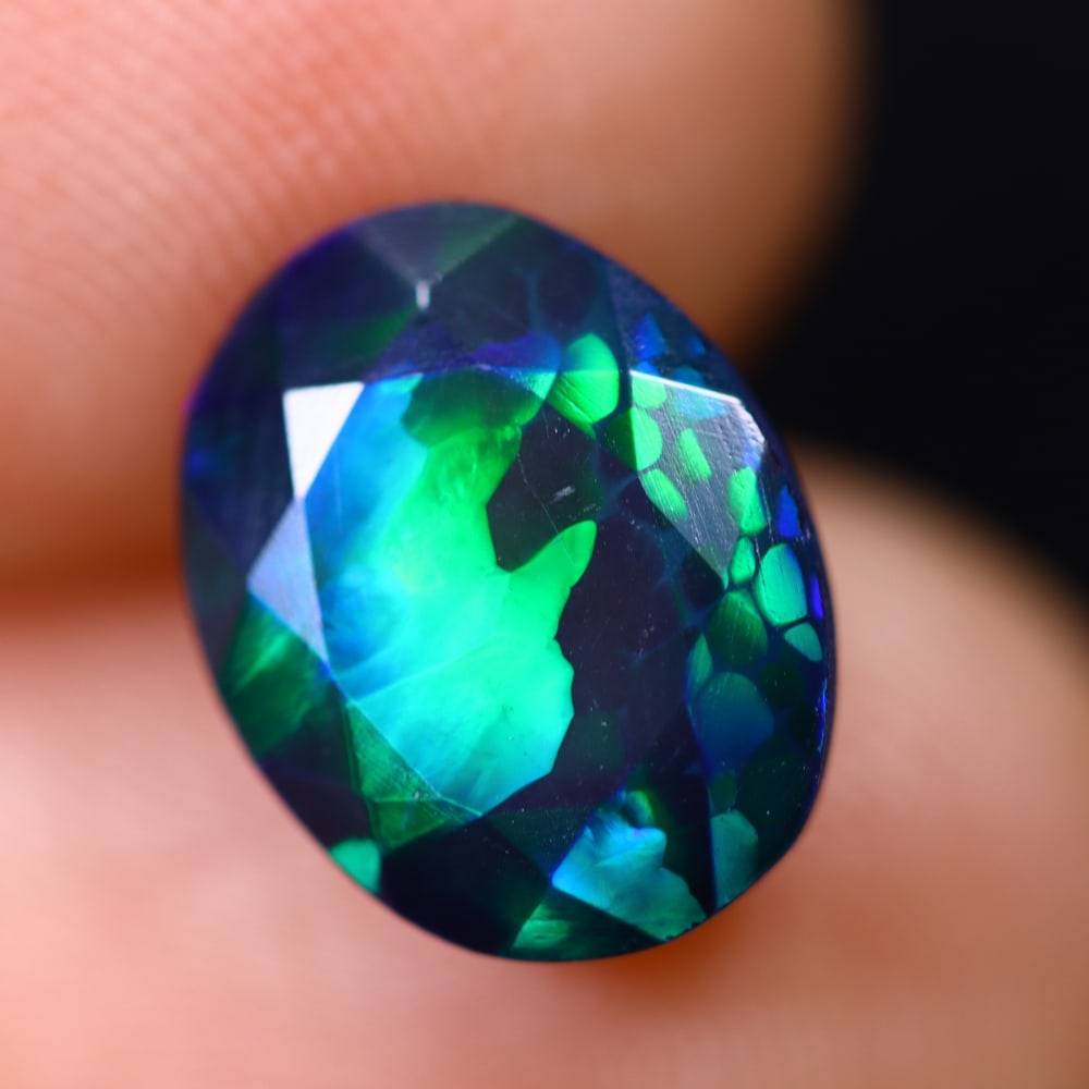 2.33Ct Welo Black Opal Polished - Ethiopian Opal , 290E: Ksmith Heritage Auctioneers Subject: Natural Ethiopian Welo Black Opal Origin: Ethiopia Carat Weight: 2.33Ct Dimension: 11.2x8.8x5.7 mm Treatment: Smoked Type: Faceted, Po