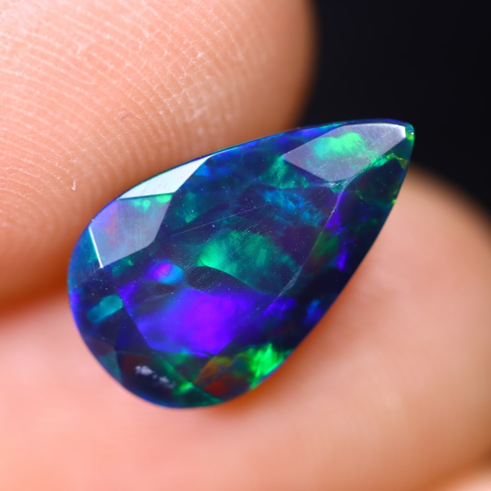 2.18Ct Welo Black Opal - Ethiopian Opal - Faceted Polished , 632E: Ksmith Heritage Auctioneers Subject: Natural Ethiopian Welo Black Opal Origin: Ethiopia Carat Weight: 2.18Ct Dimension: 13.6x8.2x5.1 mm Treatment: Smoked Type: Faceted, Po