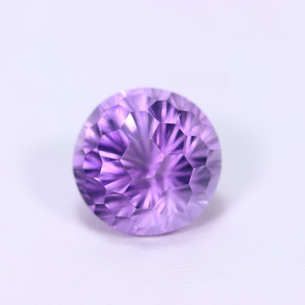 9.14Ct Purple Amethyst - Polished Faceted , 1014E: Ksmith Heritage Auctioneers Subject: Natural Amethyst Origin: Brazil Carat Weight: 9.14Ct Dimension: 13x13x10.5 mm Treatment: Untreated Type: Faceted, Polished