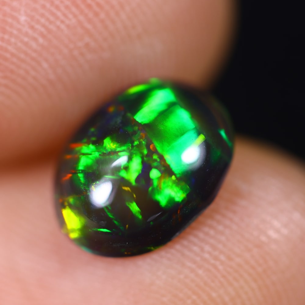 1.30Ct Welo Black Opal Polished - Ethiopian Opal , 348E: Ksmith Heritage Auctioneers Subject: Natural Ethiopian Welo Black Opal Origin: Ethiopia Carat Weight: 1.30Ct Dimension: 9.8x7.6x3.5 mm Treatment: Smoked Type: Cabochon, Po