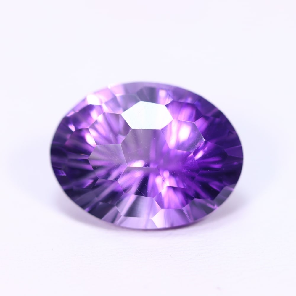 11.84Ct Purple Amethyst - Polished Faceted, 1006B: Ksmith Heritage Auctioneers Subject: Natural Amethyst Origin: Brazil Carat Weight: 11.84Ct Dimension: 17x13.4x10 mm Treatment: Untreated Type: Faceted, Polished