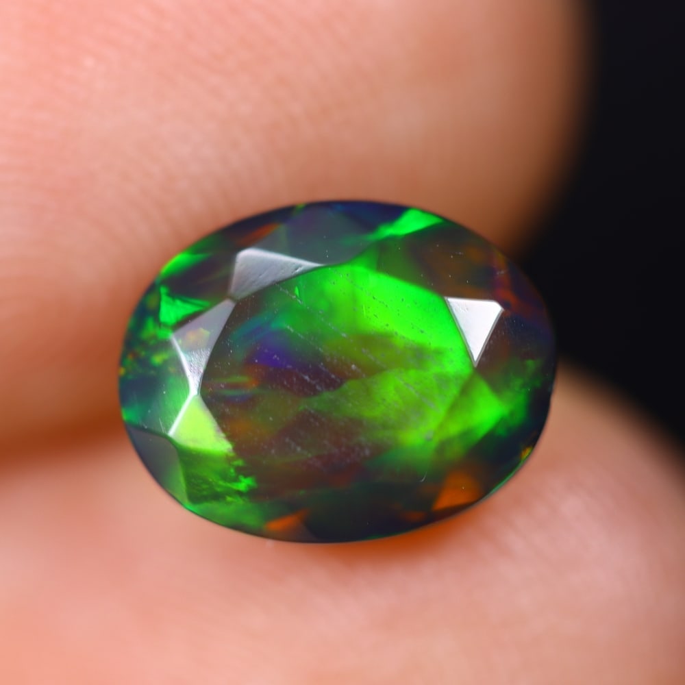 1.67Ct Welo Black Faceted Opal Polished - Ethiopian Opal , 489E: Ksmith Heritage Auctioneers Subject: Natural Ethiopian Welo Black Opal Origin: Ethiopia Carat Weight: 1.67Ct Dimension: 9.6x7.6x5.2 mm Treatment: Smoked Type: Faceted, Pol