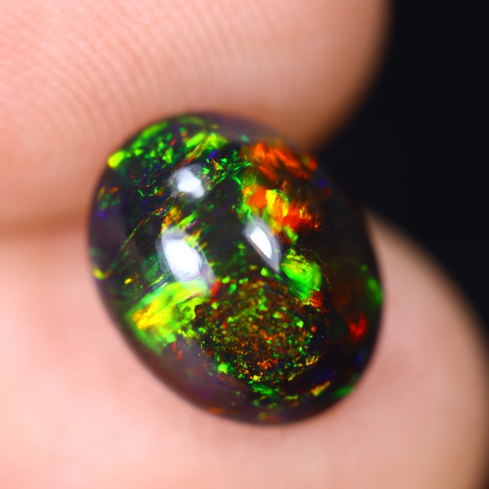 *1.85Ct Welo Black Opal Polished - Ethiopian Opal , 650E: Ksmith Heritage Auctioneers Subject: Natural Ethiopian Welo Black Opal Origin: Ethiopia Carat Weight: 1.85Ct Dimension: 10.9x8.7x4.4 mm Treatment: Smoked Type: Cabochon, P