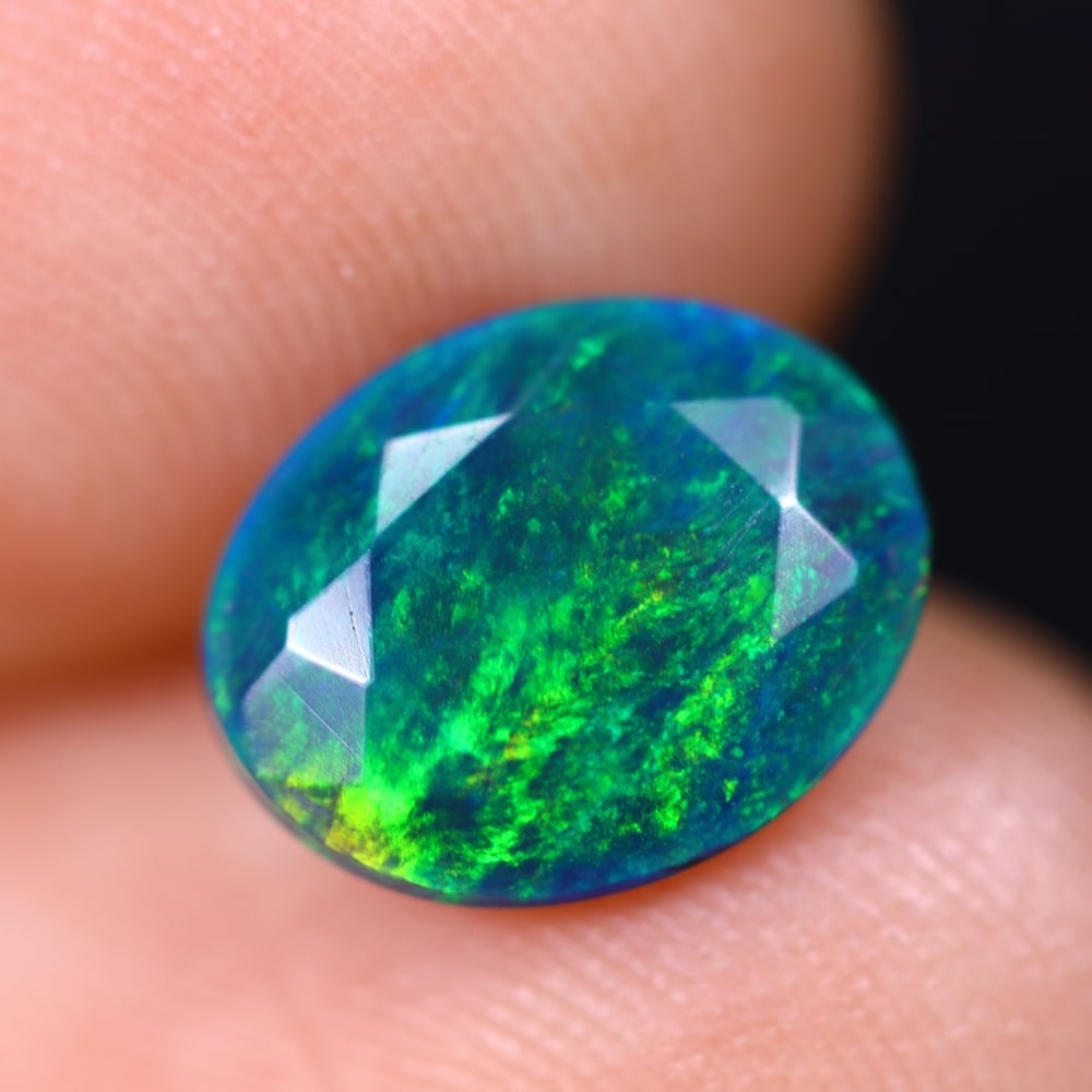 1.29Ct Welo Black Faceted Opal Polished - Ethiopian Opal , 266E: Ksmith Heritage Auctioneers Subject: Natural Ethiopian Welo Black Opal Origin: Ethiopia Carat Weight: 1.29Ct Dimension: 9.9x7.9x3.9 mm Treatment: Smoked Type: Faceted, Pol